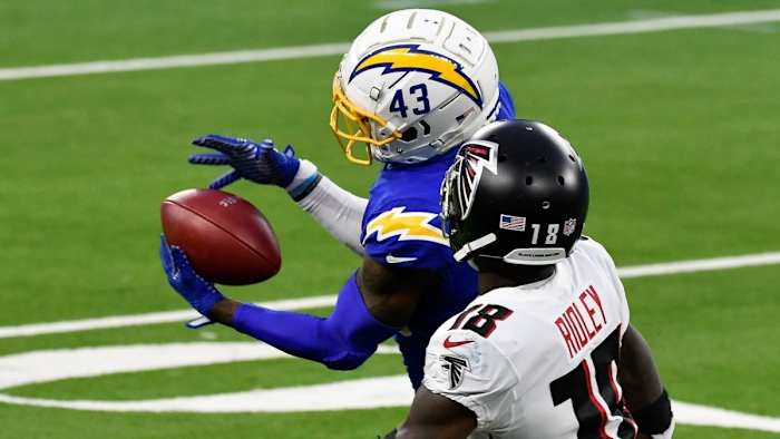 Davis intercepts a pass in front of Atlanta Falcons wide receiver Calvin Ridley.